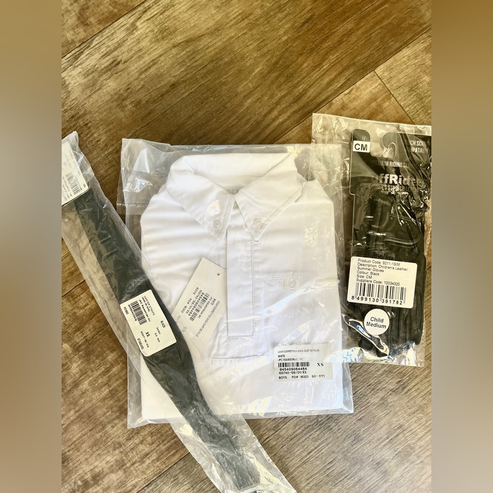Boy’s white show shirt, riding gloves, and garter straps.
